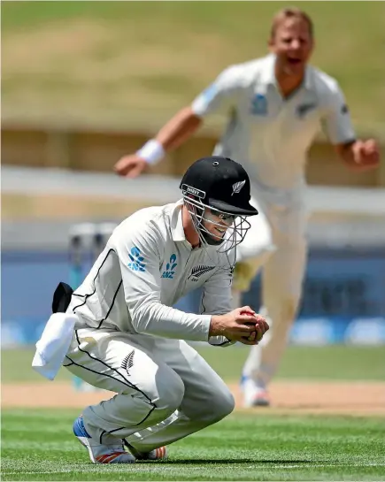  ?? PHOTO: PHOTOSPORT ?? Henry Nicholls grab a close-in catch to dismiss West Indies batsman Shane Dowrich, much to the delight of Black Caps bowler Neil Wagner.
