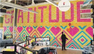  ?? ANDREW RYAN WATERLOO REGION RECORD FILE PHOTO ?? In this 2018 photo, Jim Moss stands in front of a gratitude wall made from Post-it Notes.