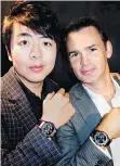 ??  ?? Pianist Lang Lang and Robbie Dickson each wore a Classic Fusion Chronograp­h Canada wristwatch at the Hublot boutique Dickson co-owns.