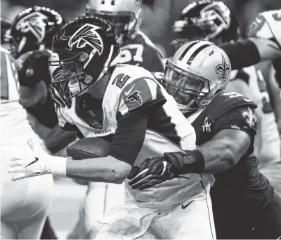  ?? AP PHOTO/BUTCH DILL ?? New Orleans Saints defensive tackle Sheldon Rankins (98) tries to sack Atlanta Falcons quarterbac­k Matt Ryan in the first half Thursday in New Orleans.