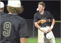  ?? Jeremy Stewart ?? Rockmart’s CJ Culver is lifted up by teammate Sam Sanders as the team celebrates on the field after defeating Harlem 7-1 early last Friday morning in Game 3 of the Class AA Elite Eight in Rockmart.