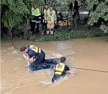  ?? ?? Fire crews checked no-one was inside a submerged vehicle in the Heathcote River yesterday.