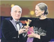  ?? — AFP photo ?? Scorsese receives the Honorary Golden Bear Award by Berlinale Executive Director Mariette Rissenbeek during the Hommage Gala Award Ceremony at the 74th Berlinale film festival in Berlin.