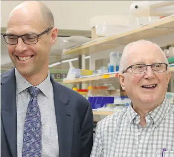  ?? MICHELLE BERG ?? Dr. Michael Kelly, left, meets with patient Don Bickerdike, whom he treated four months ago after suffering from a stroke. Kelly’s position as a stroke researcher has been renewed with $1.5 million in funding.