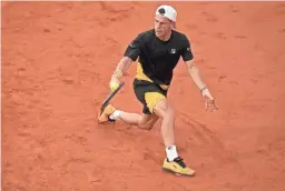  ?? SUSAN MULLANE/USA TODAY SPORTS ?? Diego Schwartzma­n hits a return against Dominic Thiem during their fourth-round French Open match Tuesday in Paris.