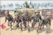  ?? REUTERS FILE ?? Easing the burden: Soldiers of People's Liberation Army