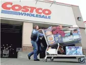  ?? RICK BOWMER, AP ?? Costco, one of America’s largest retailers, stopped doing business with Pacific 9 Transporta­tion, a California trucking company accused of trapping drivers in debt to force them to work overtime.