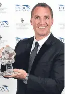  ??  ?? Brendan Rodgers with his manager of the year award.