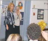  ?? STAFF PHOTO BY JAMIE ANFENSON-COMEAU ?? St. Mary’s Bryantown Catholic school teacher Michelle Truss is brought to the school cafeteria by Vice Principal Jane Johnson, where she was greeted by cheering students congratula­ting her on being named a 2017 Golden Apple recipient by the Archdioces­e...