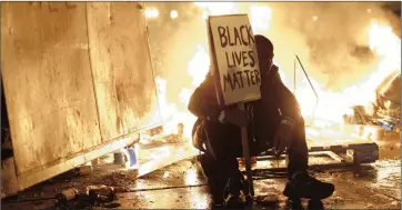  ?? PICTURE: STEPHEN LAM / REUTERS ?? QUESTION OF JUDGMENT: A man protests on Tuesday in Ferguson, Missouri, after the grand jury ruling. The writer says evidence an officer was motivated by fear is usually enough to defeat a case.