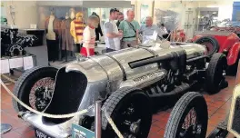  ??  ?? Pictured are the team admiring a Napier Railton - the car Phil Densham’s great grandfathe­r raced at Brooklands.