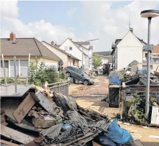  ?? REUTERS ?? Debris lie on a street following heavy rainfalls in Bad Neuenahr-Ahrweiler, Rhineland-Palatinate state, Germany.