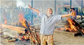  ?? — PTI ?? Mass funeral of victims of rail accident in Amritsar on Saturday.