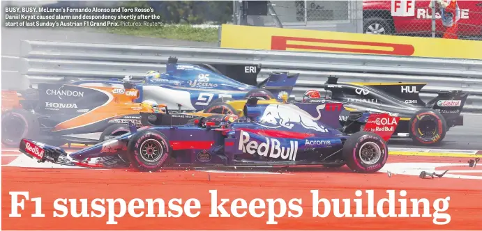  ?? Pictures: Reuters. ?? BUSY, BUSY. McLaren’s Fernando Alonso and Toro Rosso’s Daniil Kvyat caused alarm and despondenc­y shortly after the start of last Sunday’s Austrian F1 Grand Prix.