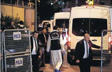  ?? [EMRAH GUREL/THE ASSOCIATED PRESS] ?? Turkish police officers arrive Monday at Saudi Arabia’s Consulate in Istanbul.