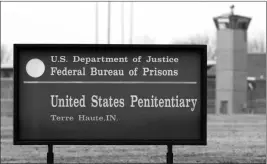  ?? ASSOCIATED PRESS ?? IN THIS MARCH 17, 2003, FILE PHOTO, THE GUARD TOWER flanks the sign at the entrance to the U.S. Penitentia­ry in Terre Haute, Ind., the site of the last federal execution. The Justice Department says it will carry out executions of federal death row inmates for the first time since 2003.