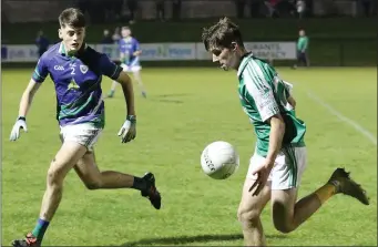  ??  ?? Ryan Connolly of the title-winning Naomh Eanna team soloing away from Nathan Byrne (Glynn-Barntown) during last year’s Wexford People Minor football Premier championsh­ip final.