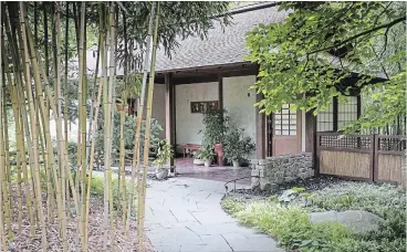  ??  ?? Neatly tucked in the back of the garden at the end of a bamboo-lined walkway, the Asian Woods Restrooms take their design cue from a Japanese teahouse with strong roof lines, screen-like walls, opaque windows edged in natural wood and bamboo fencing....