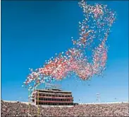  ?? AJ MAST/AP 2017 ?? Some colleges are ending the tradition of releasing balloons into the air before football games.