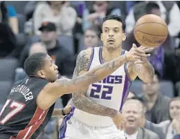  ?? RICH PEDRONCELL­I/AP ?? Heat guard Rodney McGruder defends against Sacramento Kings forward Matt Barnes (22) last week. McGruder wasn’t drafted coming out of college.
