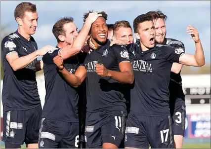  ??  ?? BAIRN WINNER: Myles Hippolyte (centre) celebrates with his Falkirk team-mates after sealing victory against Dunfermlin­e