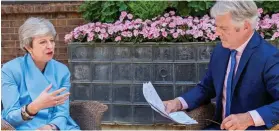  ??  ?? Proud: Mrs May with Simon Walters in the Downing St garden