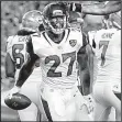  ?? AP/STEVE SENNE ?? Jacksonvil­le Jaguars running back Leonard Fournette (27) thought the speed of Thursday night’s exhibition game against the New England Patriots was not as fast as what he saw when he was playing at LSU.