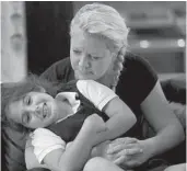  ?? MIKE STOCKER/STAFF FILE PHOTO ?? Shiraz Benyamin, who will be 8 in April, spends time with her aunt Liya Ruvio. Ruvio is Zafrit Benyamin’s sister.