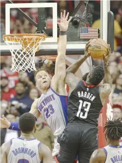  ??  ?? Detroit Pistons’ Blake Griffin defends as Houston Rockets’ James Harden drives with the ball during the third quarter at Toyota Center. — USA TODAY Sports photo