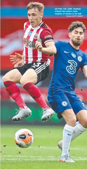  ?? Picture: GETTY IMAGES ?? GETTING THE JUMP: Sheffield United’s Ben Osborn leads Jorginho of Chelsea to the ball.
