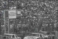  ?? JIM COOPER/GETTY IMAGES ?? The NASCAR First Union 400 in 1990 at North Wilkesboro Speedway in North Wilkesboro, N.C.