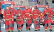  ?? AFP ?? Firefighte­rs near Paris police headquarte­rs after the attack.