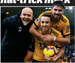  ?? GETTY IMAGES ?? Ball boy: Diogo Jota hugs his hat-trick trophy, celebratin­g with coach Julio Figueroa and Ruben Neves