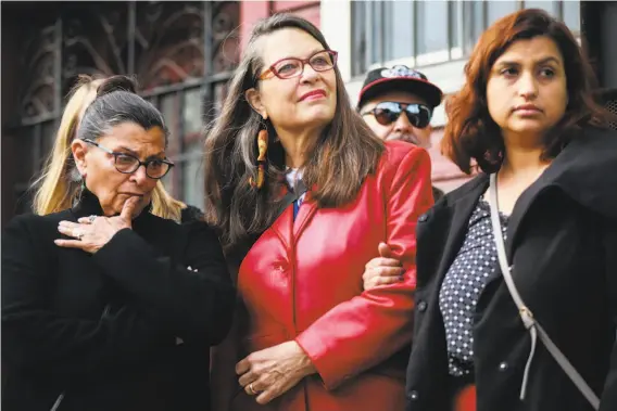  ?? Photos by Gabrielle Lurie / The Chronicle ?? Maria Pinedo (left), Kate Connell and Vita Paramo listen during a news conference about the possible eviction of Galería de la Raza from its longtime home.