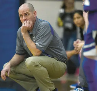  ?? COURANT FILE ?? East Hampton girls’ basketball head coach Shaun Russell has been reinstated after an investigat­ion into an apparent shoving incident in a game in December.