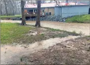  ??  ?? / Continubut­ed by Billy Wayne Abernathy Little Cedar Creek was rising rapidly Tuesday behind A &amp; B Creekside Restaurant and Catering in Cave Spring. The rear deck has been a popular spot when the weather is nice.