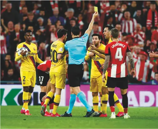  ??  ?? Caution...Lionel Messi is booked in the cup defeat at Athletic Bilbao