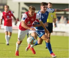  ??  ?? Regan Donelon battles with Henry Cameron. Pics: Conor Wyse.