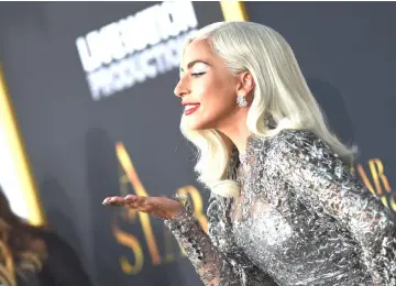  ??  ?? Lady Gaga and Cooper (inset below) attends the premiere of ‘A Star is Born’ at the Shrine Auditorium in Los Angeles, California on Monday. — AFP photos