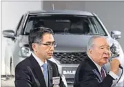  ?? AFP PHOTO ?? Suzuki chairman Osamu Suzuki (R) and company president Toshihiro Suzuki during Baleno’s launch in Tokyo.