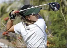  ?? The Maui News / MATTHEW THAYER photos ?? LEFT PHOTO: The University of Hawaii’s Zoey AkagiBusti­n tees off on No. 3 Monday. RIGHT PHOTO: Portland State’s Jasmine Cabajar watches her tee shot on No. 4.