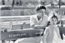  ?? ?? Magubane, and one of his best-known images, of a young girl and her nanny on separate benches