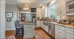  ?? ?? Strong features of the kitchen include a breakfast bar and a separate area with pantry storage.