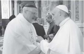  ??  ?? Monsignor Anders Arborelius of Stockholm, left, shown here greeting Pope Francis last June, is one of five cardinals named Sunday. L'Osservator­e Romano, via AP