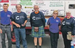  ??  ?? David McLaren, far right, is creating his own Straight Story as he drives a tractor round the coast of Scotland to raise money for Cancer Research UK; and above, David, centre, with members of the Oban CRUK committee. Photograph­s: Kevin McGlynn