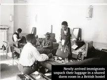  ??  ?? Newly arrived immigrants unpack their luggage in a shared dorm room in a British hostel