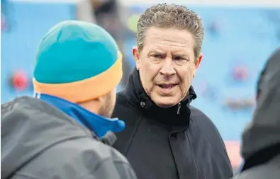  ?? RICH BARNES/GETTY IMAGES ?? Former Dolphins quarterbac­k Dan Marino was on the sidelines Dec. 24 as Miami took on the Buffalo Bills in Orchard Park, N.Y. This is the first season under owner Steve Ross that Marino has worked for the Dolphins on the football side of operations.