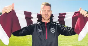  ??  ?? Oliver Bozanic sports his new colours after signing for the Tynecastle side.