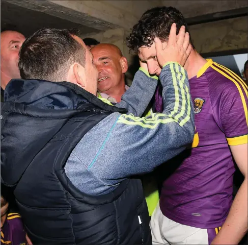  ??  ?? Davy Fitzgerald congratula­ting full-back Liam Ryan after that memorable semi-final victory over arch-rivals Kilkenny.