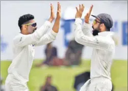  ?? AFP ?? Indian cricket team captain Virat Kohli (R) and Ravindra Jadeja celebrate after dismissing Sri Lankan batsman Angelo Mathews during the fourth day of the first Test match between Sri Lanka and India at Galle Internatio­nal Cricket Stadium in Galle on...